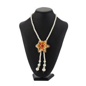 Pearl Necklace with a Large Polished Glass Flower Shape Pendant